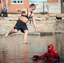 Northwest student Pat Laky leaps into Colden Pond during the 2012 plunge. 