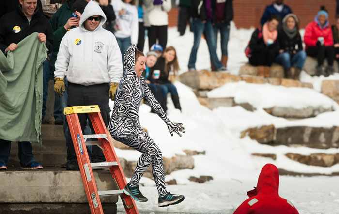 Northwest Missouri State student Tassi Cook takes her turn jumping into Colden Pond during the 2013 Colden Pond Plunge. This year's Colden Pond Plunge is set for Feb. 21. (Northwest Missouri State University)
  