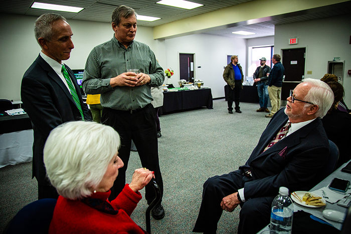 Northwest President Dr. John Jasinski (standing at left) converses with President Emeritus Dr. Dean Hubbard (seated at right), during an event to celebrate the 20th anniversary of the launch of Northwest Online. Also pictured are former first lady Aleta Hubbard and Associate Professor of Geography Dr. Ted Goudge. (Photos by Carly Hostetter/Northwest Missouri State University)