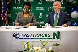 MCC Chancellor Dr. Kimberly Beatty and Northwest President Dr. John Jasinski sign an updated agreement signaling the relaunch of their institutions' collaboration on FastTracks.