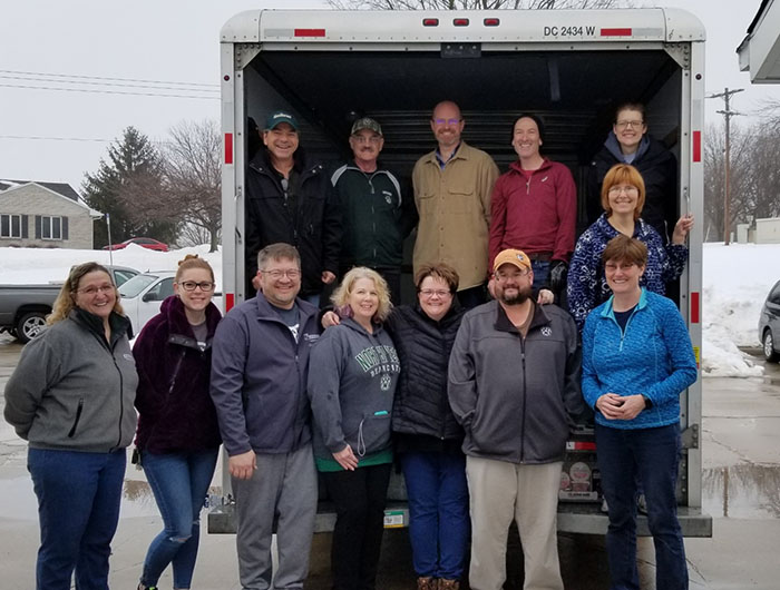 Members of the Northwest Movers and Shakers pose for a photo after helping move a new staff member's belongings into her new home recently. The group of Northwest faculty and staff comes together regularly to assist new University employees with the moving process. (Submitted photo)