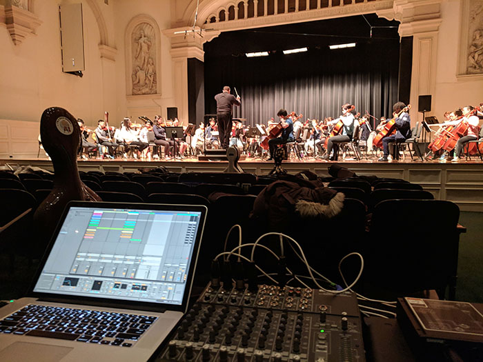 The Peabody Modern Orchestra at Johns Hopkins University, shown during a rehearsal, premiered Northwest alumnus Robert Langenfeld's composition, “Celestial Body,” in February. (Submitted photos)