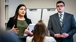 Public Relations Manager Jocelyn Contreras and Marketing Strategist Nathan Galbraith pitch their campaign ideas to the Maryville Tourism Committee.