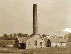 The Power Plant was constructed on the newly established Northwest campus in conjunction with the Administration Building, which opened in 1910. In 1928, the University built a taller smoke stack and rebuilt a portion of the Power House when they installed a 390-horsepower steam boiler. (Northwest Missouri State University Archives)  