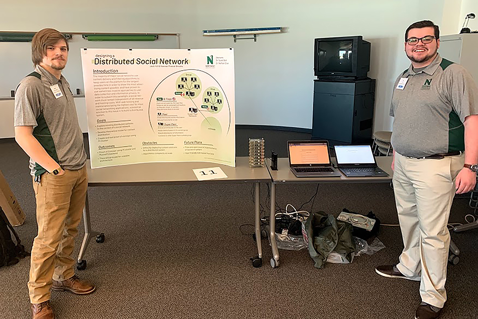Northwest students Keenan Piveral-Brooks, left, and Jack Hill placed first at the Consortium for Computer Science in Colleges Central Plains annual conference for their poster, “Designing a Distributed Social Network.” (Submitted photo)