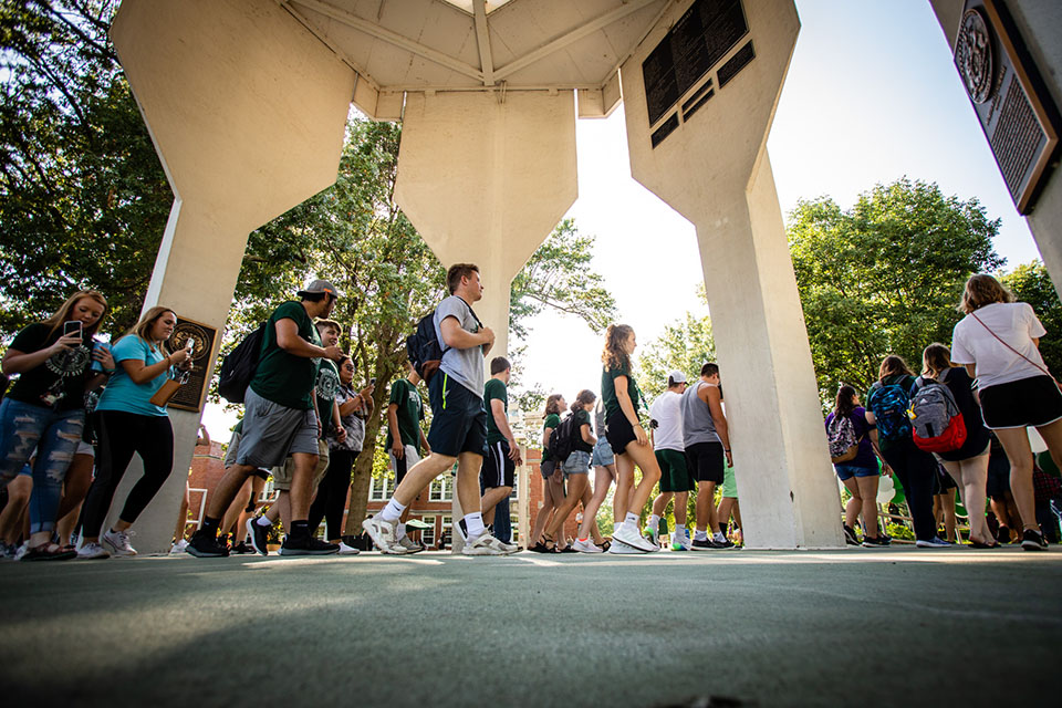Northwest first-year and transfer students pass under the Memorial Bell Tower during the annual March to the Tower to conclude convocation and Advantage activities Tuesday. More than 1,300 freshman arrived on campus Saturday to begin their college careers at Northwest. (Photos by Todd Weddle/Northwest Missouri State University)