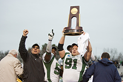 Tjeerdsma and members of the Bearcat football team raise the championship trophy after winning the 2009 NCAA Division II national football championship in Florence, Alabama.