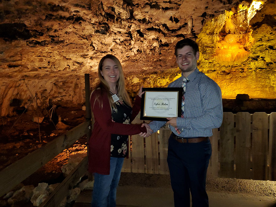 Tyler Helm (right), receives the O.R. Grawe Award, which is presented annually to an outstanding geology student, from the Association of Missouri Geologists President Carey Bridges. (Submitted photo)