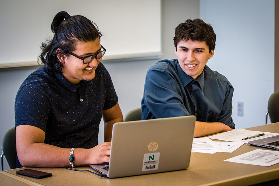 Software engineering students Susan Maharjan (left) and Dakota Gravitt on Monday participated in an annual programming contest sponsored by Kansas City-based electrical services company Evergy. (Photo by Amanda Wistuba/Northwest Missouri State University).