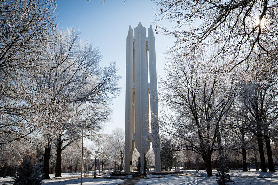 The landscape surrounding the Memorial Bell Tower is coated with snow after a December snowfall. (Photo by Scott Meadows/Northwest Missouri State University)