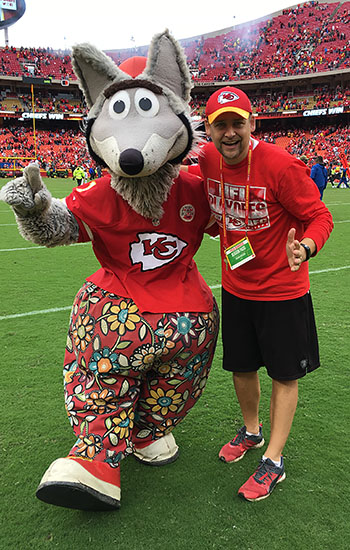 Shawn Emerson works with Chiefs mascot K.C. Wolf as a game assistant.