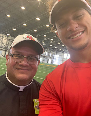 Father Richard Rocha with Patrick Mahomes