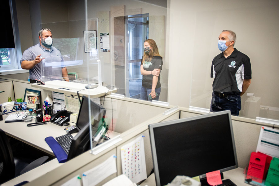 Environmental Health and Safety Specialist Ben Rogers, Associate Bursar Lindsay Stapley and President Dr. John Jasinski visited Northwest's cashiering office recently to see mitigation measures put in place at the University to help prevent the spread of coronavirus. (Photo by Todd Weddle/Northwest Missouri State University)