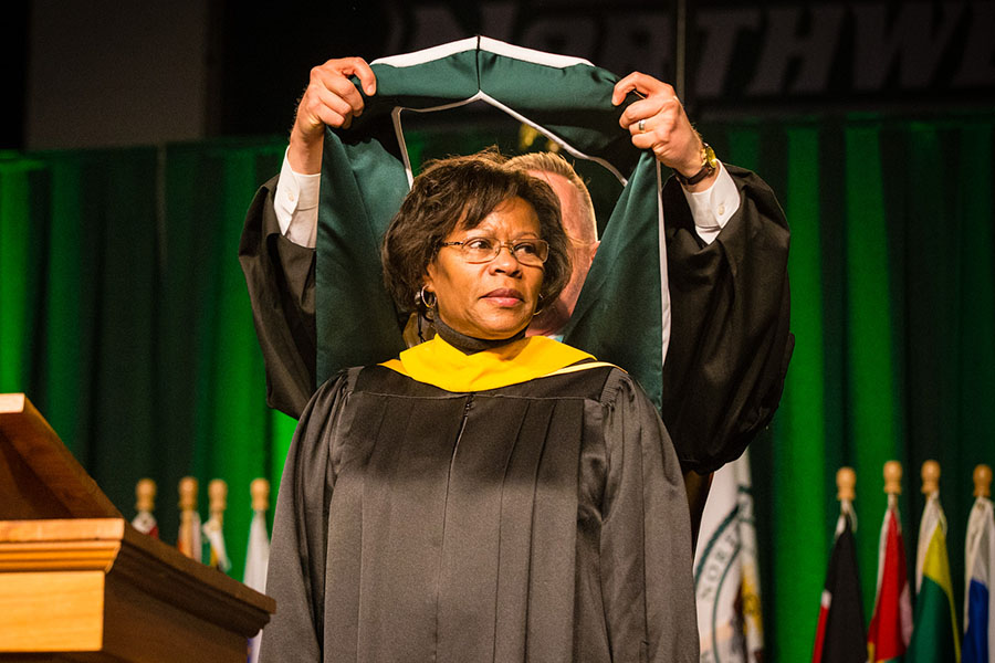 Karen Daniel receives a hood during Northwest's 2017 spring commencement ceremony, acknowledging her as a recipient of the honorary Doctor of Humane Letters degree.  (Northwest Missouri State University photo)