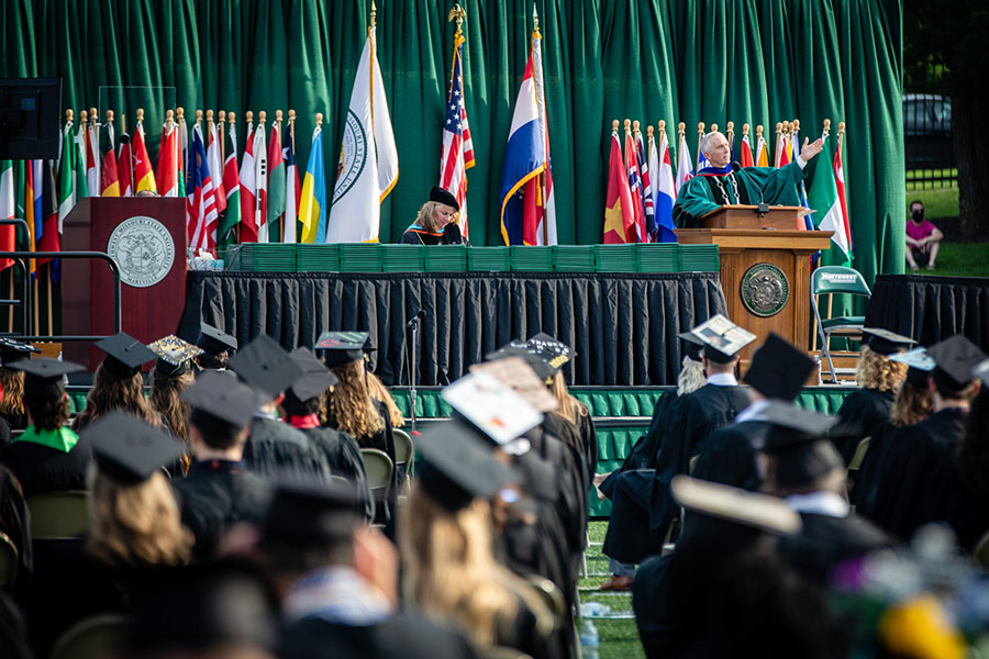 Northwest President Dr. John Jasinski address graduates and loved ones gathered at Bearcat Stadium for the University's spring commencement ceremony.