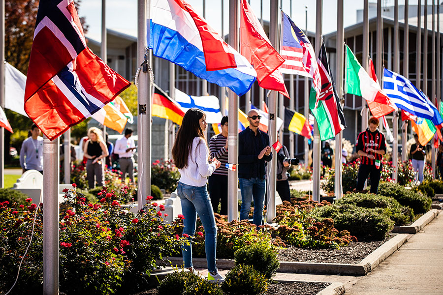 Northwest international students wait to raise the flags of their native countries during the University's annual International Flag-Raising Ceremony last year. The ceremony will be part of Northwest's Homecoming week activities again this fall, though other events are canceled or limited as a result of the ongoing COVID-19 pandemic. (Photo by Todd Weddle/Northwest Missouri State University)