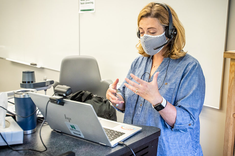 Psychology instructor Cris Jacobson speaks with students on Zoom during a hybrid class session where some of her students also were attending inside the classroom. A variety of technology resources are helping Northwest faculty continue teaching through the pandemic.