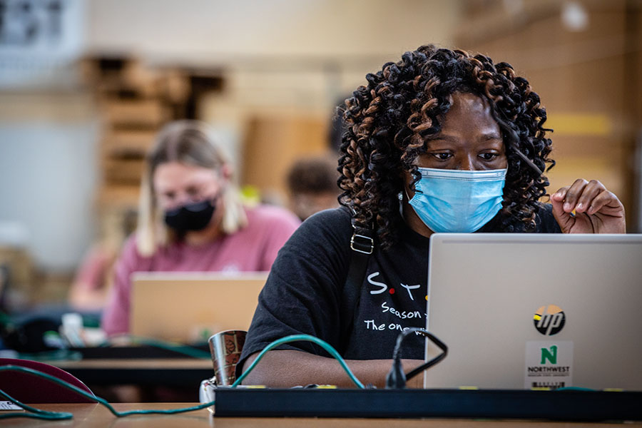 Above, students set up their new Northwest laptops as the campus opened in August for the 2020-21 academic year. The University's long-standing laptop rental program helps students save on tuition costs compared to their peers at other universities and it has provided them with an advantage during the COVID-19 pandemic. (Photos by Todd Weddle/Northwest Missouri State University)