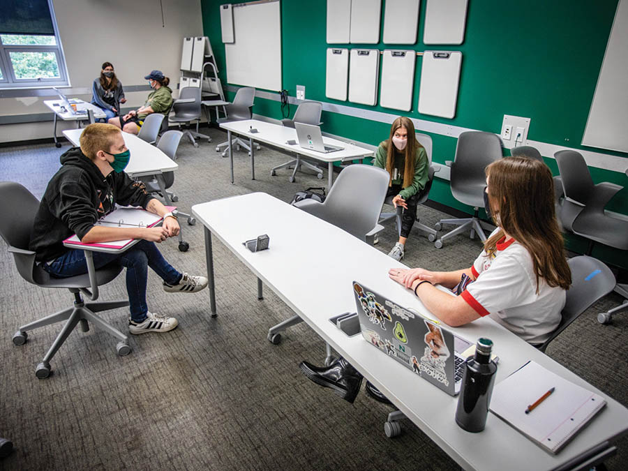 Northwest students in a classroom this fall for face coverings and kept their distance from each other. Things were different in 1918-19 when the influenza pandemic forced the institution to close from Oct. 11 through Nov. 26, and students made up for the lost time by attending classes on Saturdays. (Photo by Todd Weddle/Northwest Missouri State University)