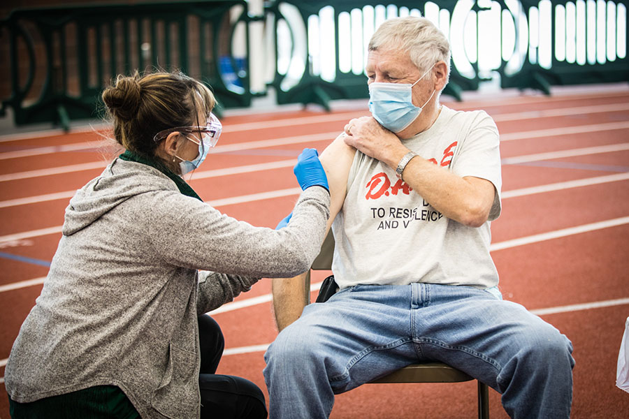 A nurse administers a COVID-19 vaccine to a local resident during the county's first vaccination clinic Tuesday at Northwest's Hughes Fieldhouse. A second vaccination clinic is scheduled for Tuesday, Feb. 4. (Photo by Brandon Bland/Northwest Missouri State University)