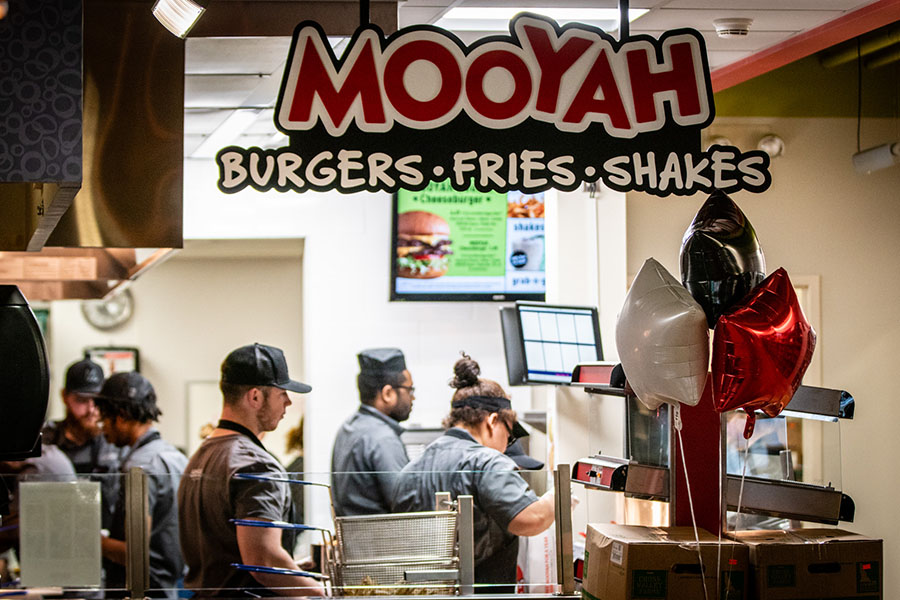 Mooyah (pictured during its opening in January 2019) offers custom burgers, fries and shakes in The Station on the Northwest campus. The location, along with Chick-fil-A and Einstein Bros. Bagels at the Student Union, is now offering curbside pickup. (Photo by Todd Weddle/Northwest Missouri State University)