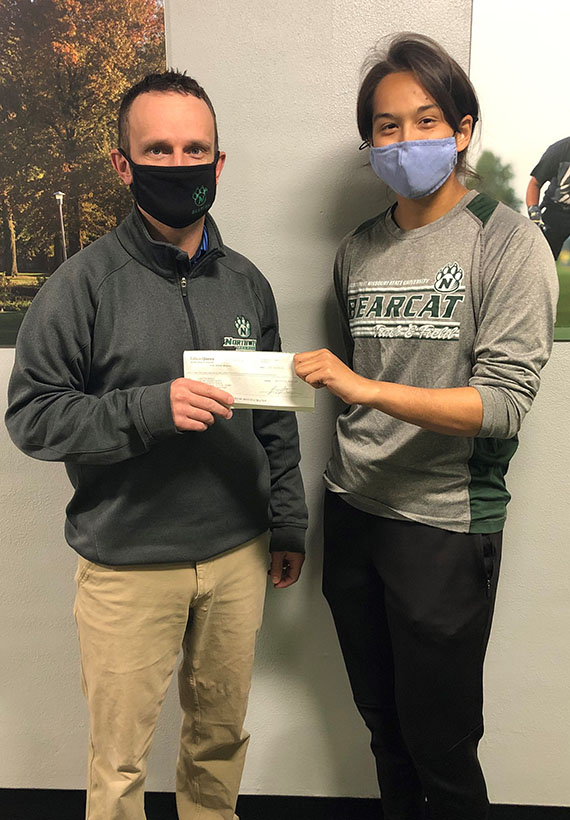 Dr. Tyler Tapps recently presented a check to Lisette Perez in recognition of her scholarship award from the Missouri Park and Recreation Association Charitable Trust. 