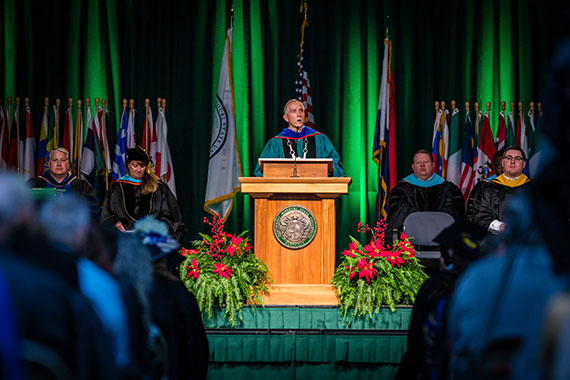 Northwest President Dr. John Jasinski addresses graduates and their families during a Northwest commencement ceremony.