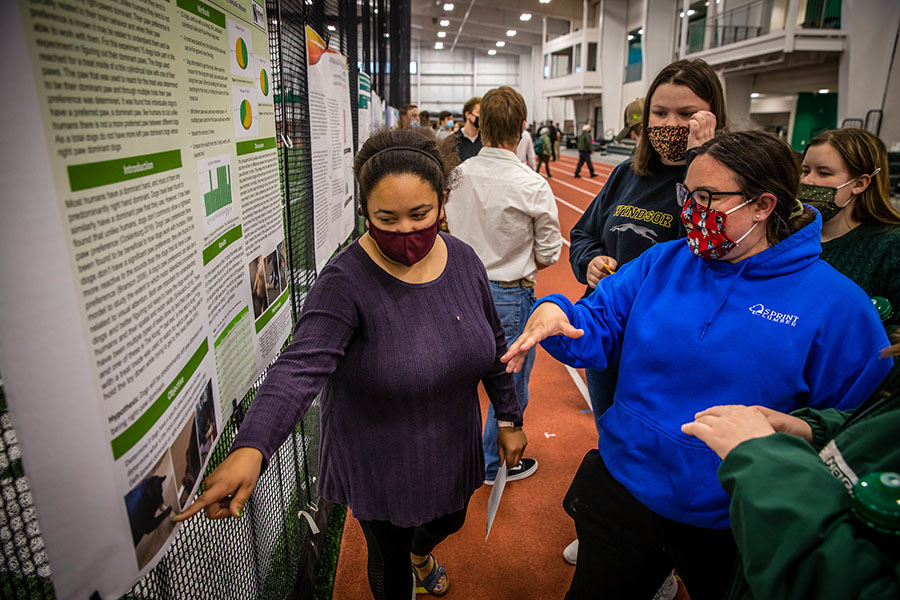 A student presents a poster during Career Services' spring PBL Palooza at the Carl and Cheryl Hughes Fieldhouse. Students presented 67 posters during the event, which occurs each semester. (Photos by Todd Weddle/Northwest Missouri State University) 