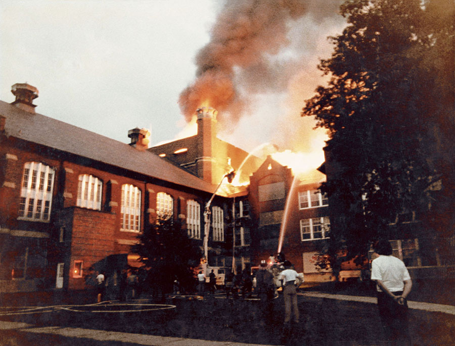 Flames shoot through the roof of the Administration Building's west wing on the night of July 24, 1979. 
