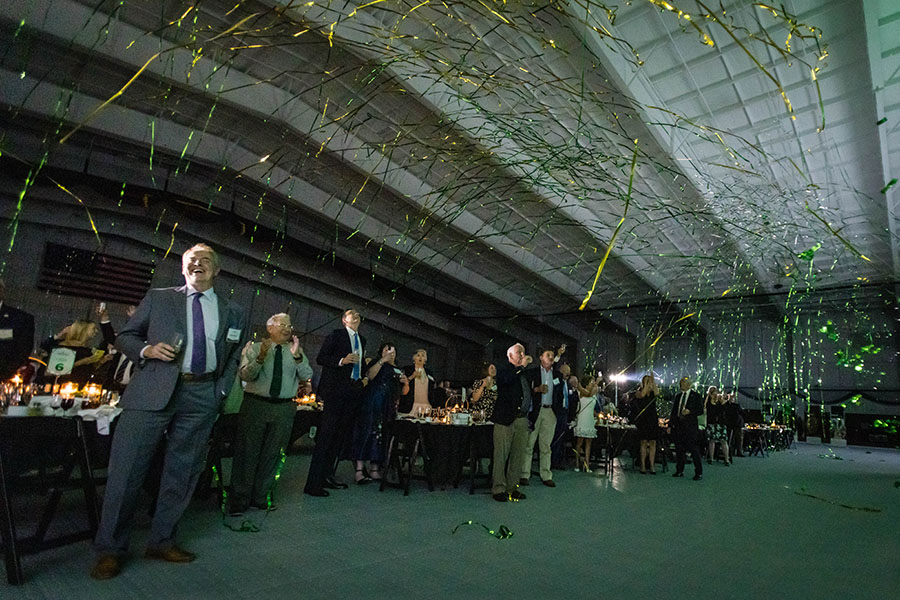 Streamers fell over attendees of a Friday night celebration at the Hughes Fieldhouse after the University announced its Forever Green campaign raised $55,026,782, exceeding its goal by more than $10 million.