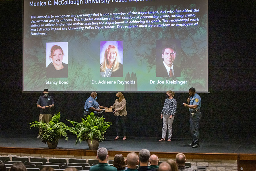 The University Police Department, during Friday's All-Employee Meeting, presented faculty members Stancy Bond, Dr. Joe Kreizinger and Dr. Adrienne Reynolds with its inaugural Monica C. McCullough University Police Department Service Award. (Photo by Todd Weddle/Northwest Missouri State University)