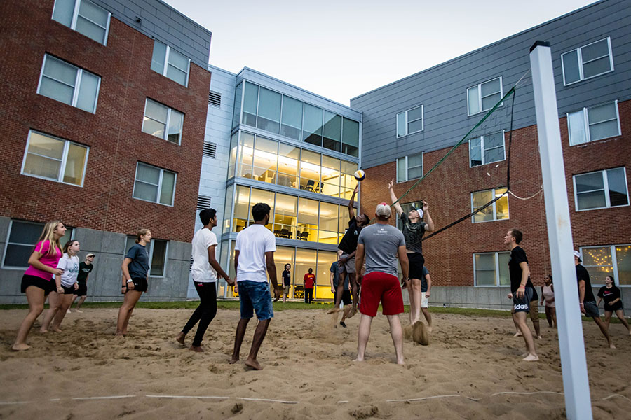 Students played sand volleyball outside a Northwest residence hall after moving in Saturday. (Photo by Todd Weddle/Northwest Missouri State University)