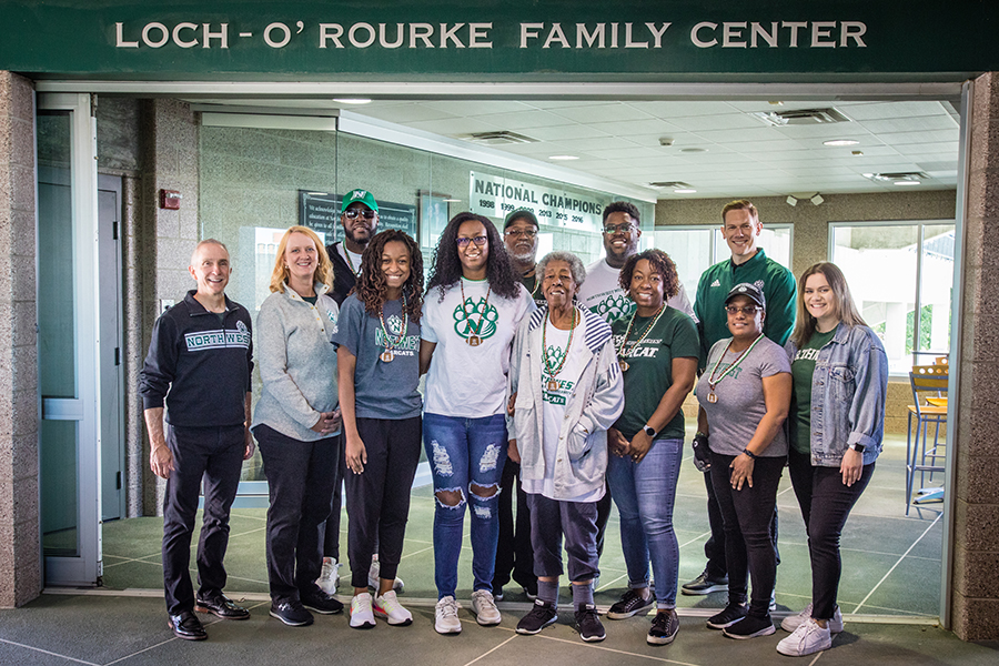 The Wyatt family was honored as Northwest's 2021 Family of the Year. Left to right in the front row are Northwest President Dr. John Jasinski; Mitzi Marchant, the vice president of university advancement and executive director of the Northwest Foundation; Mirissa Corbin; Joslin Wyatt; Alpha House; Erica Wyatt, Paula Rector Davis; and Student Senate President Bailey Hendrickson. Left to right in the back row are Calvin Davis, Vincent Wyatt, Marcellus Corbin and Northwest Director of Campus Dining Spencer Martin. Zerryn Gines and Briona Monroe are not pictured. (Photo by Todd Weddle/Northwest Missouri State University)