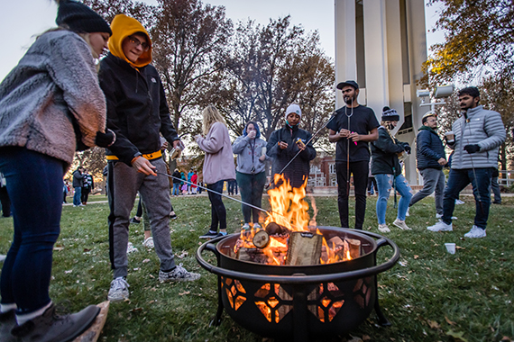 Northwest students roasted marshmallows and made s'mores over a fire at the annual Holiday Tree Lighting ceremony.
