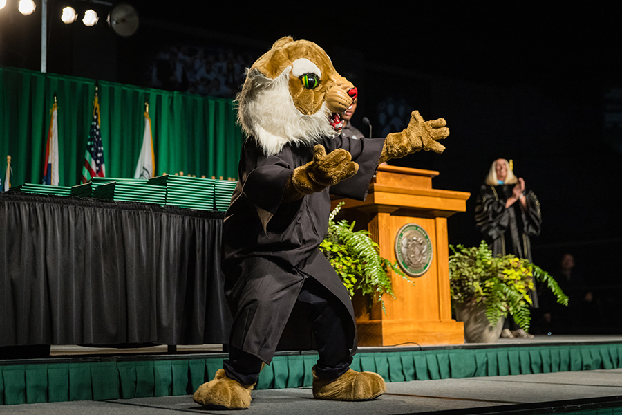 Northwest mascot Bobby Bearcat leads the crowd in the playing of the Bearcat fight song.