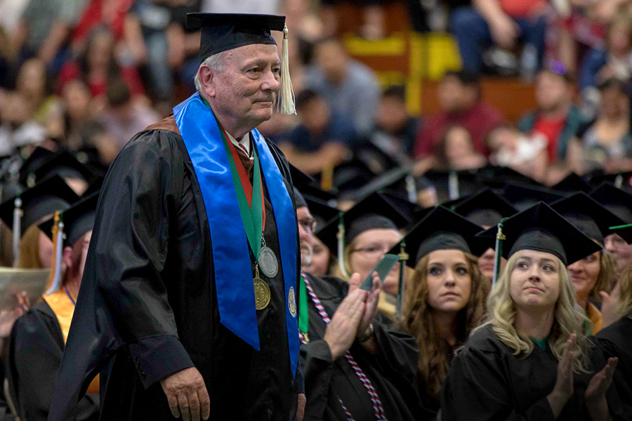 Steve Drake, pictured participating in a Northwestern Michigan College commencement ceremony, has maintained a passion for learning and teaching that now spans 57 years. (Photo courtesy of Northwestern Michigan College) 
