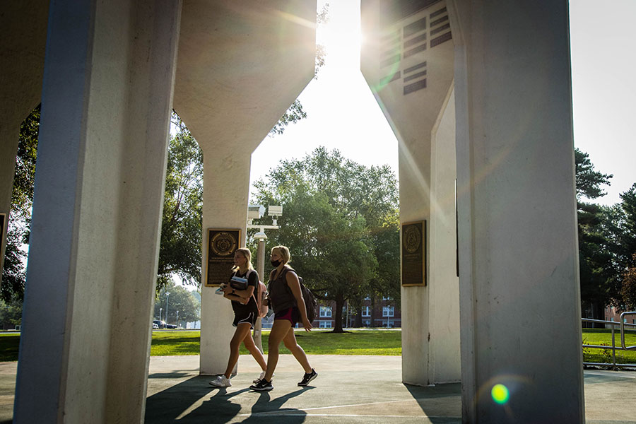 A pair of Northwest students walk under the Memorial Bell Tower on the University's Maryville campus last fall. (Photo by Todd Weddle/Northwest Missouri State University)