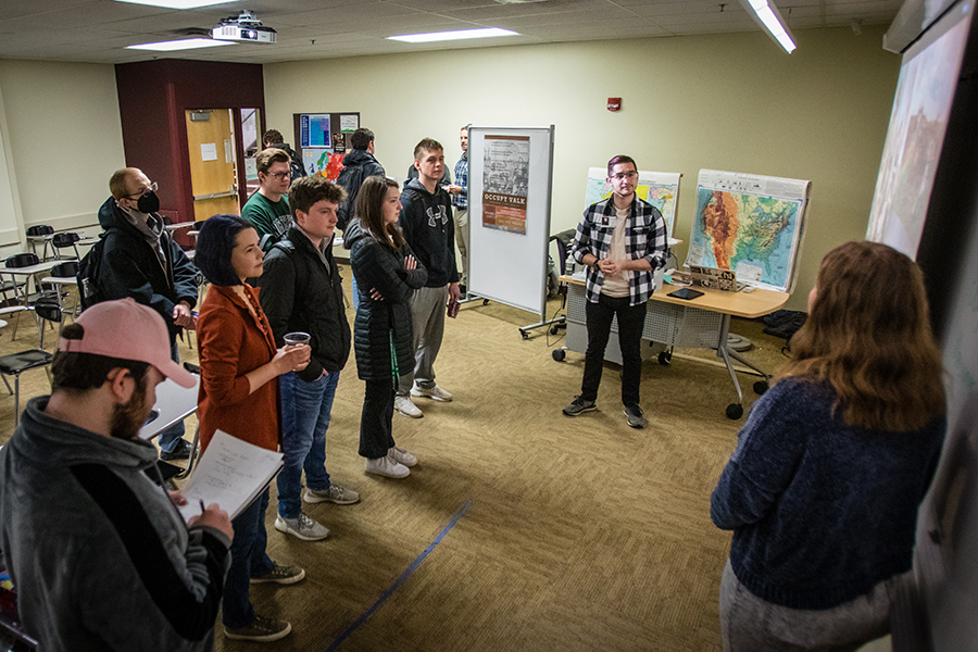 Students portraying artists Bouguereau and Meissonier discussed the contrasts of their work featuring cherubim and military battles.