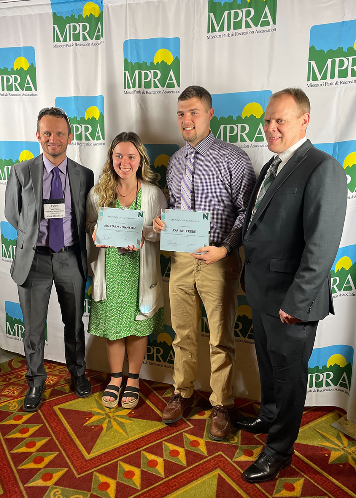 Pictured, left to right, are Associate Professor of Recreation Dr. Tyler Tapps, Morgan Johnson, Isaiah Prebe and Dr. Terry Long, the director of Northwest's School of Health Science and Wellness, as Johnson and Prebe accepted undergraduate scholarship awards from the Missouri Park and Recreation Association Charitable Trust. (Submitted photo)