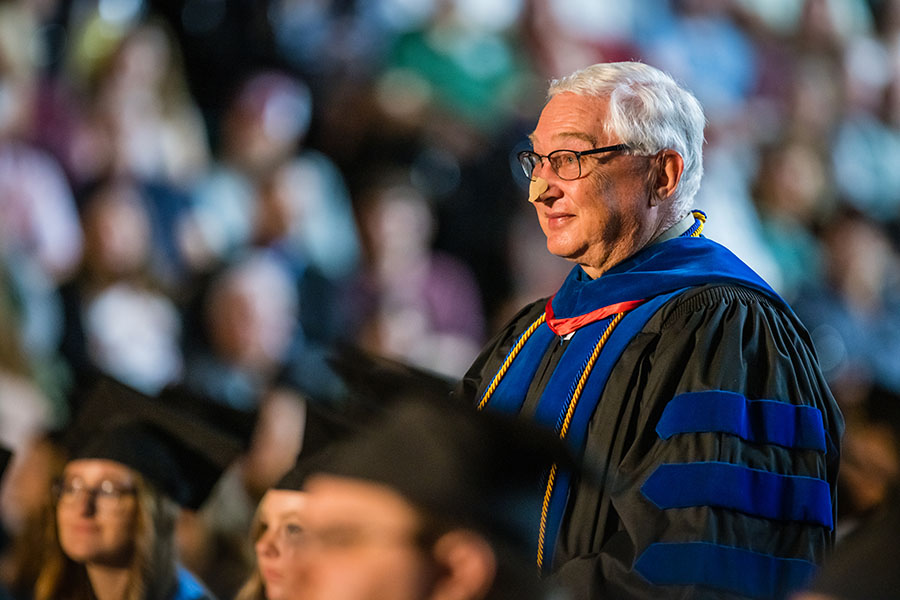 Dr. Mike Wilson stood to be recognized May 7 during one of Northwest's commencement ceremonies for the completion of a bachelor’s degree in theatre performance, which he earned after serving the University for 27 years as a faculty member. (Photo by Todd Weddle/Northwest Missouri State University)
