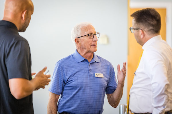 Dr. Bob Burrell converses with members of the Foundation Board of Directors during their July meeting on the Northwest campus.