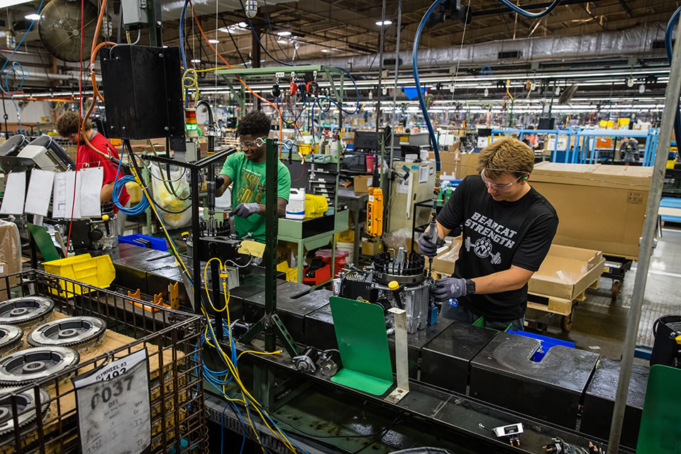 Nearly 40 Bearcat student-athletes worked an assembly line at at Kawasaki, completing small engines measuring up to 24 horsepower.