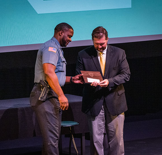 University Police Lt. Anthony Williams congratulates Nodaway County Associate Circuit Judge Robert Rice as he was recognized Friday with the Raymond L. Ottman University Police Department Community Service Award.