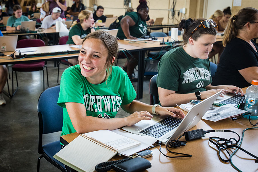 Students received their laptops and took time to get to know their features after moving onto campus Saturday. (Photo by Lauren Adams | Northwest Missouri State University)