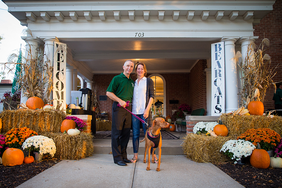 John and Denise Jasinski stand with their dog, Ruby, outside the historic Thomas Gaunt House on the Northwest campus as it was decorated for the fall. (Northwest Missouri State University photos)