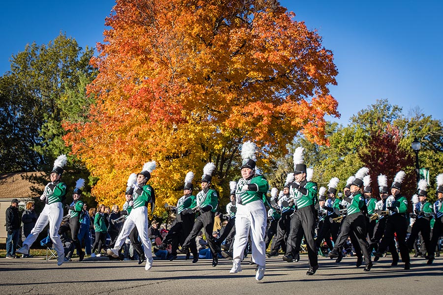 The Bearcat Marching Band entertains crowds gathered on Fourth Street for the annual Homecoming Parade. (Photo by Todd Weddle/Northwest Missouri State University)