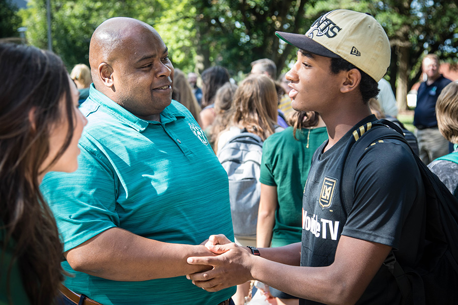 Malcolm Anthony, a freshman mass media major from Kansas City, Kansas, greets Northwest Interim President Dr. Clarence Green after the University's convocation for first-year students in August. Anthony was one of nine students to participate in Northwest's inaugural Jump Start program this fall. (Photo by Abigayle Rush/Northwest Missouri State University)