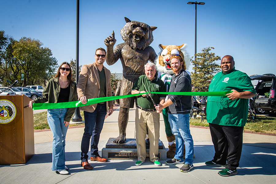 Northwest dedicated its Bobby Bearcat statue during Homecoming activities Saturday. Left to right are Student Senate President Elizabeth Motazedi; sculpture artist Brandon Crandall; Northwest friend and donor Ron Houston; Joe Jasinski, the son of Dr. John and Denise Jasinski; and Northwest Interim President Dr. Clarence Green. (Photos by Lauren Adams/Northwest Missouri State University)