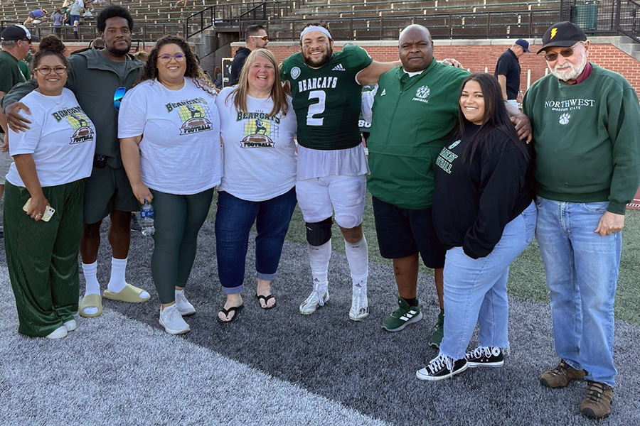 The Green family is pictured after a Northwest football game. Left to right are Kelsi, Adam McNairy, Kaylee, Chelli, Elijah, Clarence and Brooklyn with Dr. Roger Neustadter, a retired Northwest professor and mentor of Dr. Clarence Green. (Submitted photo)