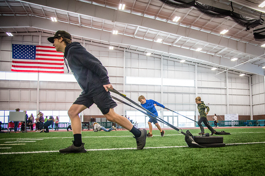 Above and below, local students participated in Veterans Day activities last year at the Carl and Cheryl Hughes Fieldhouse. 